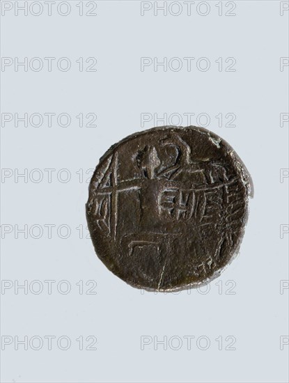 One of a group of silver coins in both Greek and local styles found at Ad Dour in Umm al Qawain Emirate, indicating a flourishing foreign trade