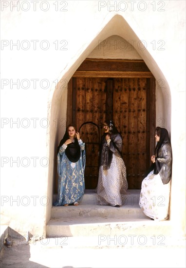 Young women wearing traditional costumes and jewellery