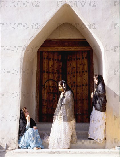 Young women wearing traditional costumes and jewellery