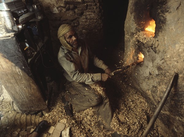 Blacksmith at his forge