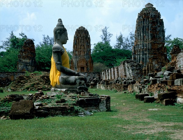 The temple ruins of Wat Chaiwatthanaram and Buddha statue