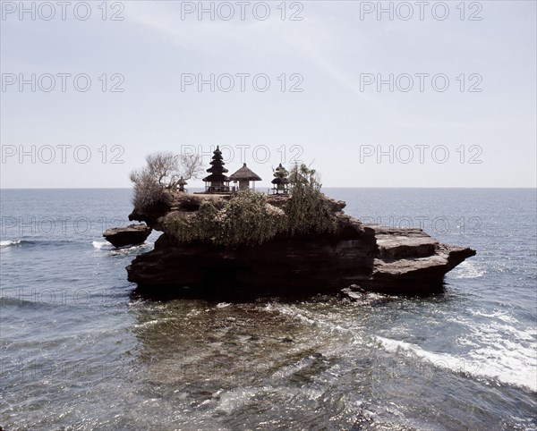 Tanah Lot, a small temple on a rocky outcrop cut off at high tide, is one of the most spectacular and popularof the island's thousands of temples