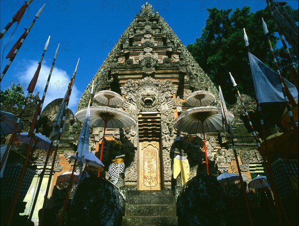 The covered gate at a temple in Ubud adorned for a festival