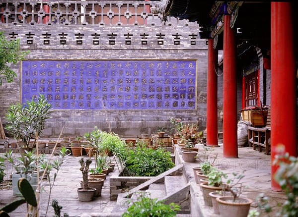 The calligraphic tile wall in front of the "Lower Hall" where the Buddhist Sutras are kept at the Haayon Monastery