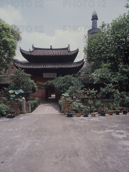 The courtyard and minaret of the Memorial Mosque to the Prophet, the Huai Sheng Si, more usually known as Beacon Tower Mosque, where the Islamic minaret rises above the roofline of traditional Chinese architecture