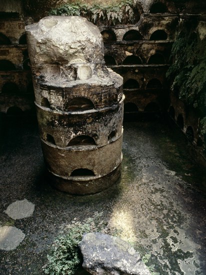 A columbarium tomb, its walls lined with niches for urns containing the ashes of the dead