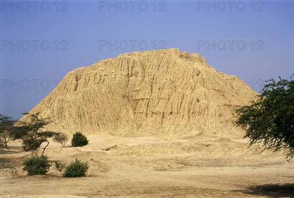 View of major eroded mud-brick pyramid at Mochica site of Tucume