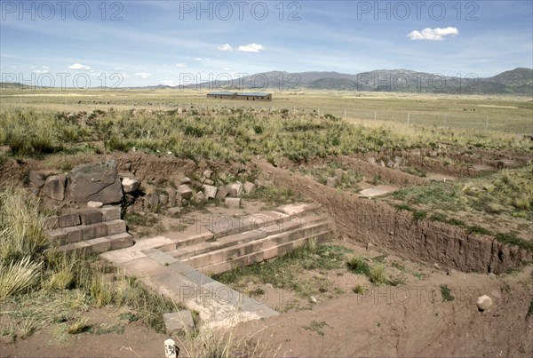 Temple architecture emerging from the soil at the Puma punku sector of Tiahuanaco (Tiwanaku)