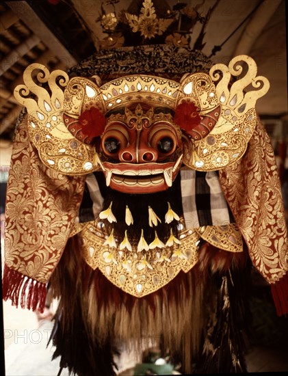 In the storehouse of the temple offerings are made to the spirits drawn into the masks