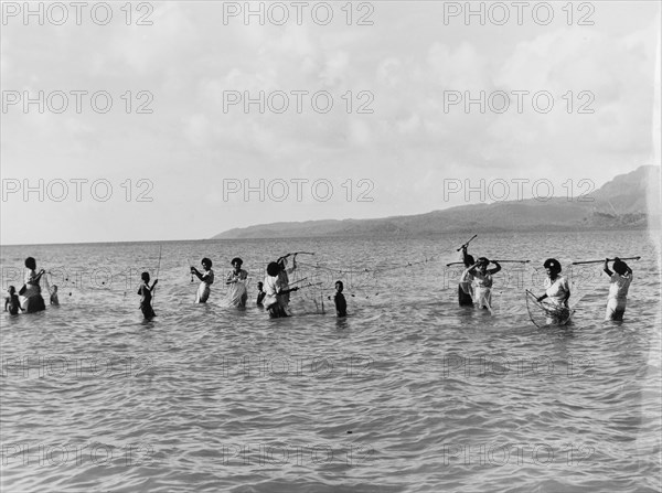 Women and children fishing in Fiji