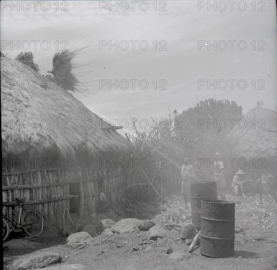 Isubo: Roof of small house being thrown up