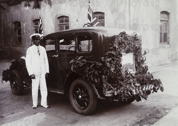 Rear view of garlanded car registration no. L4484