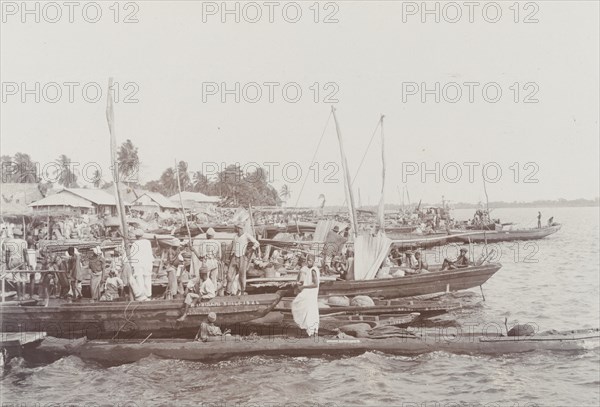 Boats with merchandise lining the shore at Badagry on market day