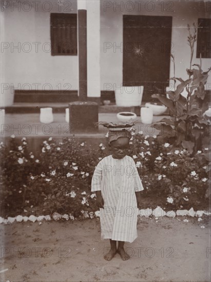 Young African boy called Bobby in garden