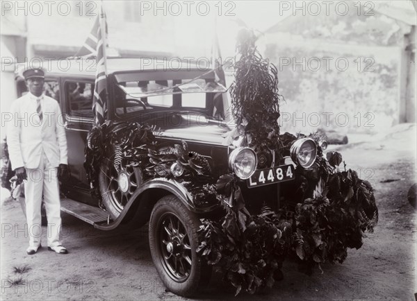 Garlanded car registration no. L4484 with chauffeur