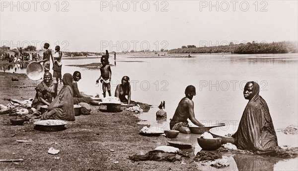 Women washing clothes in the river at Wau, Bahr-El-Ghazal