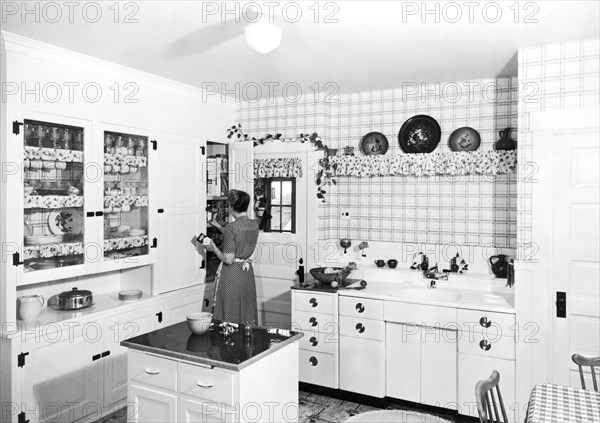 Woman Cooking In Her Kitchen