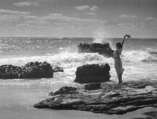 Woman Waving On Shore