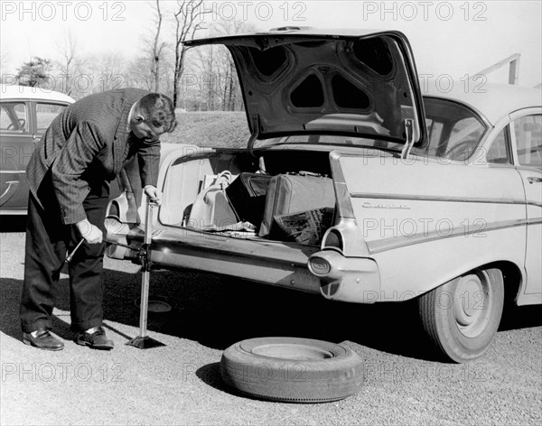 Man Jacking Up A Car