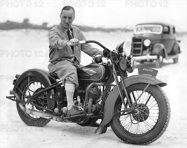 Malcolm Campbell On A Harley