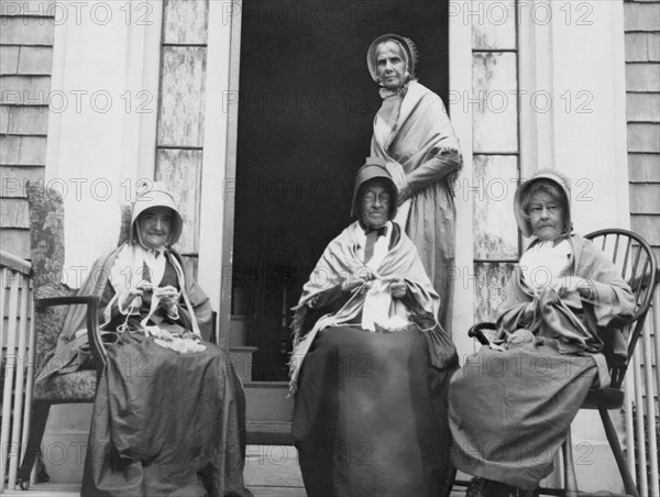 Women Knitting On A Porch