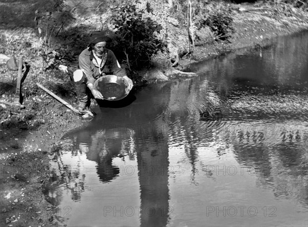 Miner Panning For Gold