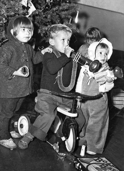 Three children celebrating Christmas