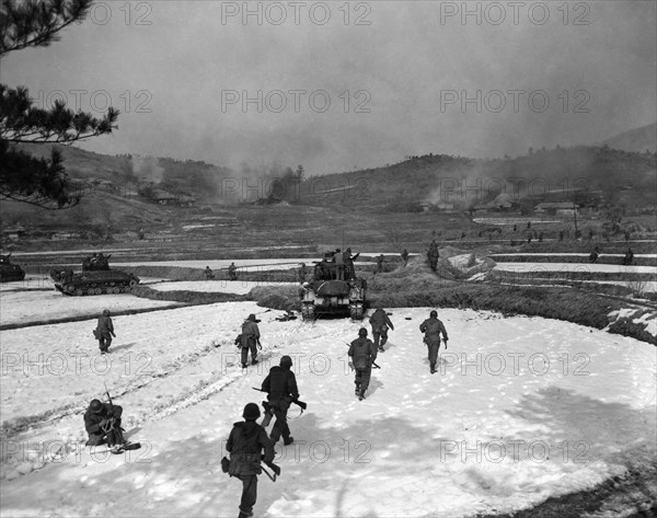 Korea:  February 4, 1951.
Soldiers of the United States 1st Calvary Division move out on an assault of a Communist held hill in Korea.