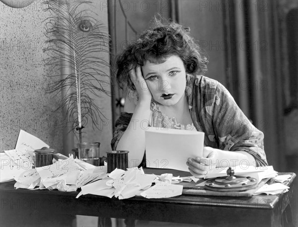 A Depressed Woman At Desk