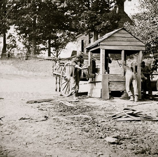 Fredericksburg, Virginia. Soldiers drawing water from a well. Army of the Potomac 1864