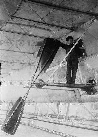 Man posing next to propeller of Wellman air ship, Spitzbergen