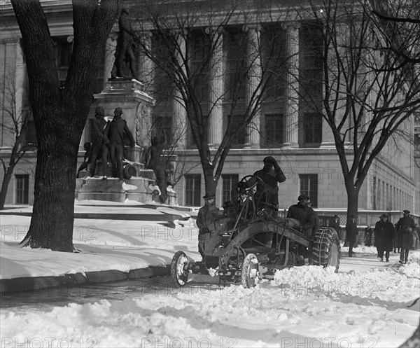 A Ford Tractor cleans snow on DC Street 1924