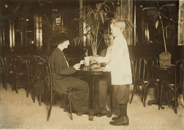 A young table boy in Newsome's ice cream parlor. 1914