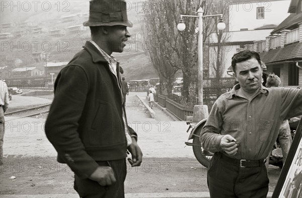 African American and a while man look at a sign 1935