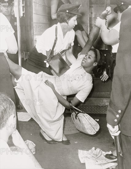 African American woman being carried to police patrol wagon  1963