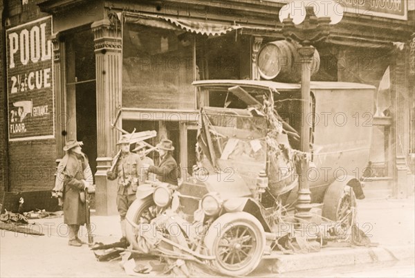 After flood in Dayton Ohio, a van is slammed against a lamp post. 1924