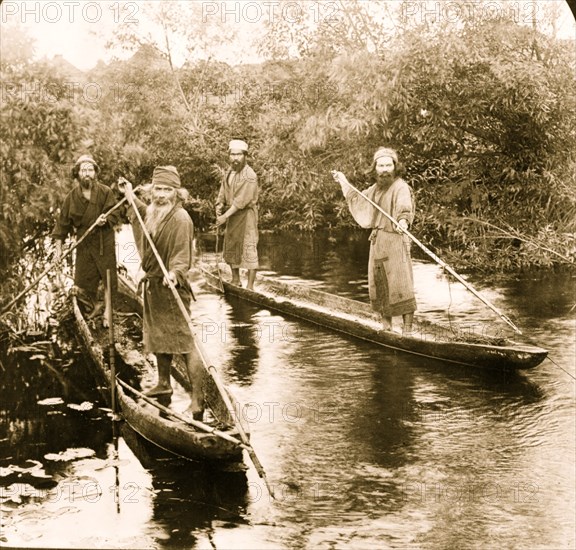 Ainu fishermen on their primitive boats, Yezo, Japan 1906