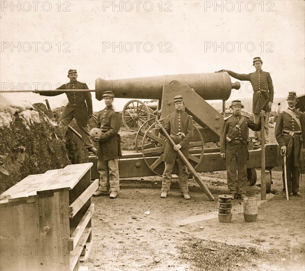 Loading 24-pdr. siege gun on wooden barbette  1863