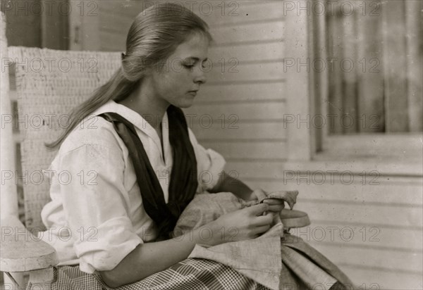 Betsey Price, First year high school at her Club sewing. 4 H Club work, Marlinton, W. Va. Location 1921