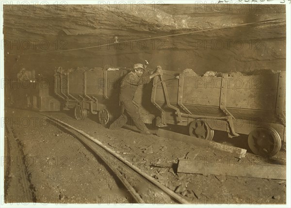 Boy braking on motor train 10 hrs. a day.  1908