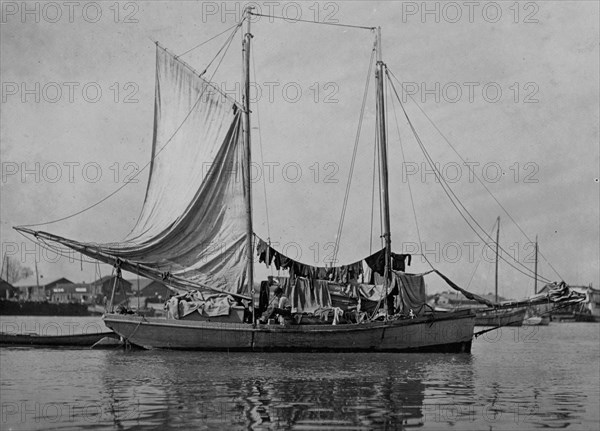 Boy shucking oysters, he helped to catch. A few young boys are employed on the oyster boats and to shuck them but times are slack now. Apalachicola, Fla.  1909