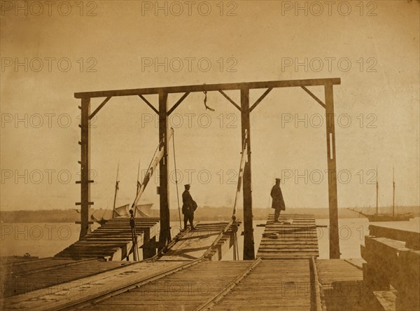 Bridges by means of which cars are loaded upon or unloaded from arks or barges 1863