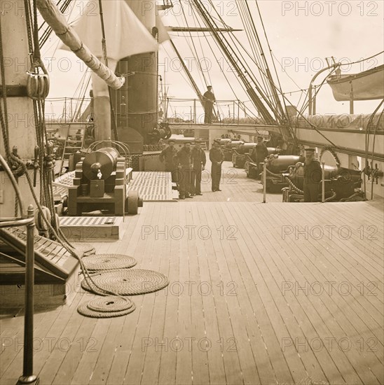 Charleston Harbor, S.C. Crew members, quarterdeck, and starboard battery of U.S.S. Pawnee] 1865