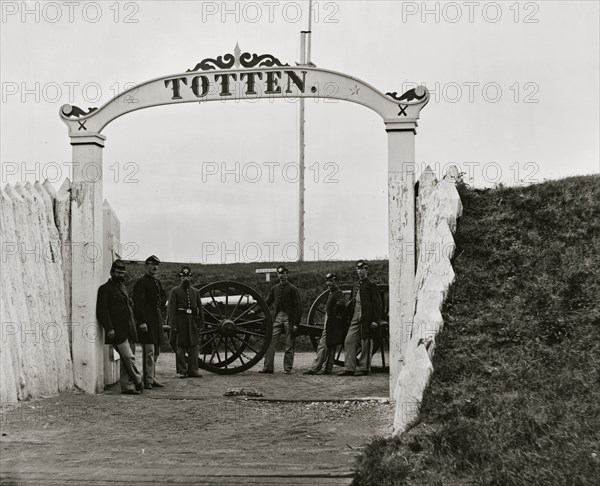 District of Columbia. Men and gun of 3d Massachusetts Heavy Artillery at ornamental gate of Fort Totten 1865