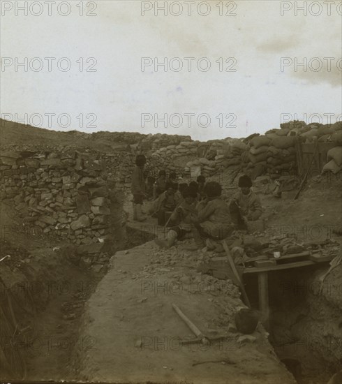 Eating their noonday soup in a Russian trench  1905