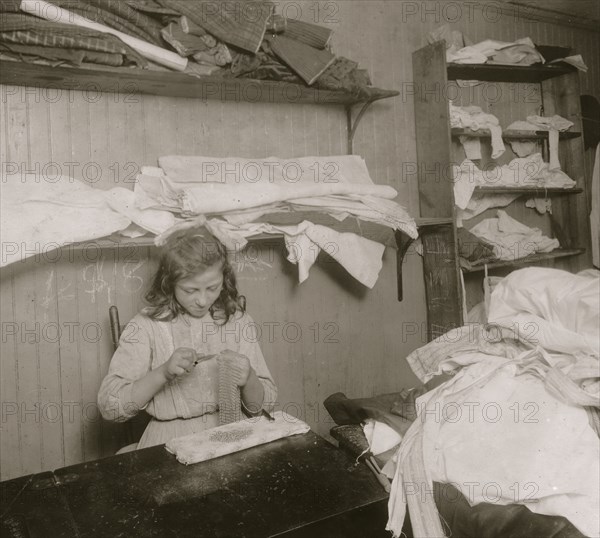 Elvira Christofano making chain-bags. 1912