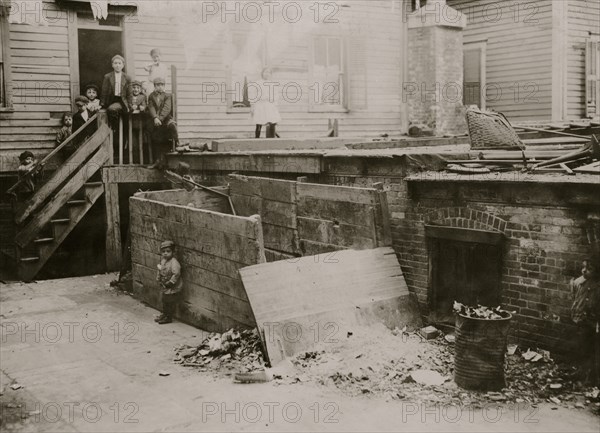 Entrance to the crowded, dirty house of a Midwife, rear tenement on Spruce Street, Providence, R.I. 1912