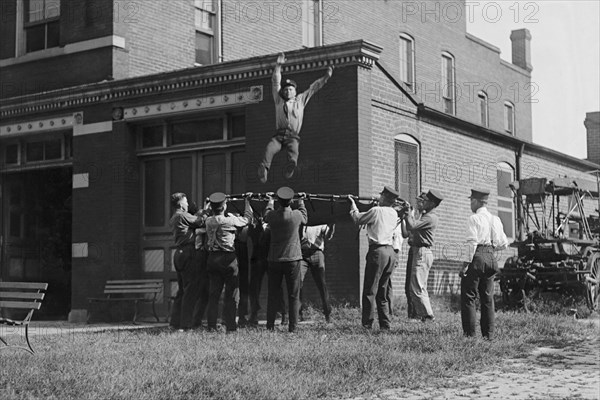 Firefighter Jumps into Net Held by Fellow Firemen 1920