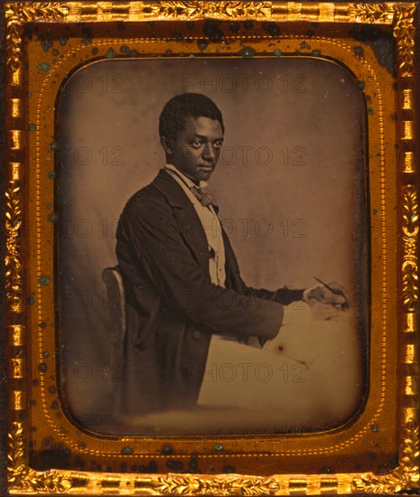 James B. Yates, three-quarter length portrait, three-quarters view, seated in chair at desk 1857