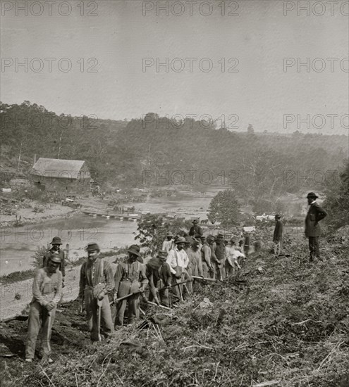 Jericho Mills, Va. Party of the 50th New York Engineers building a road on the south bank of the North Anna, with a general headquarters wagon train crossing the pontoon bridge 1864